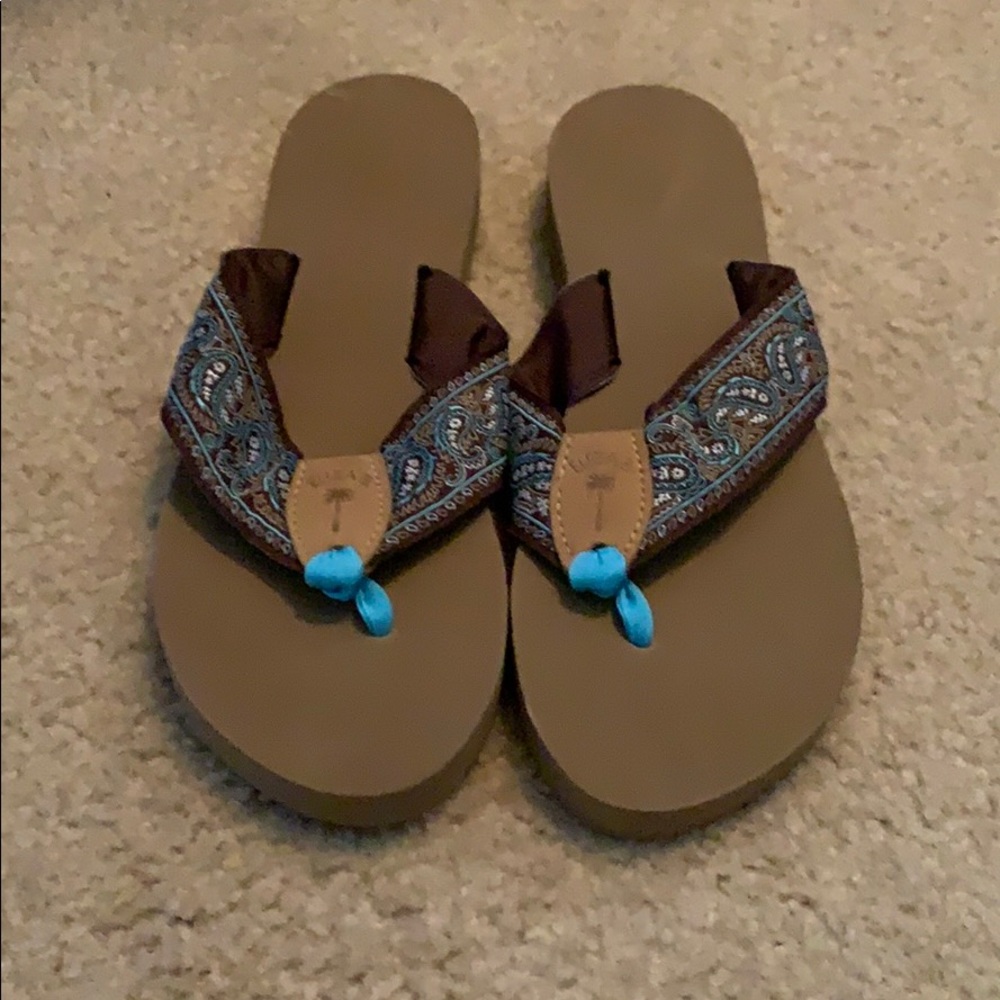 Eliza B flip flops. Never worn.